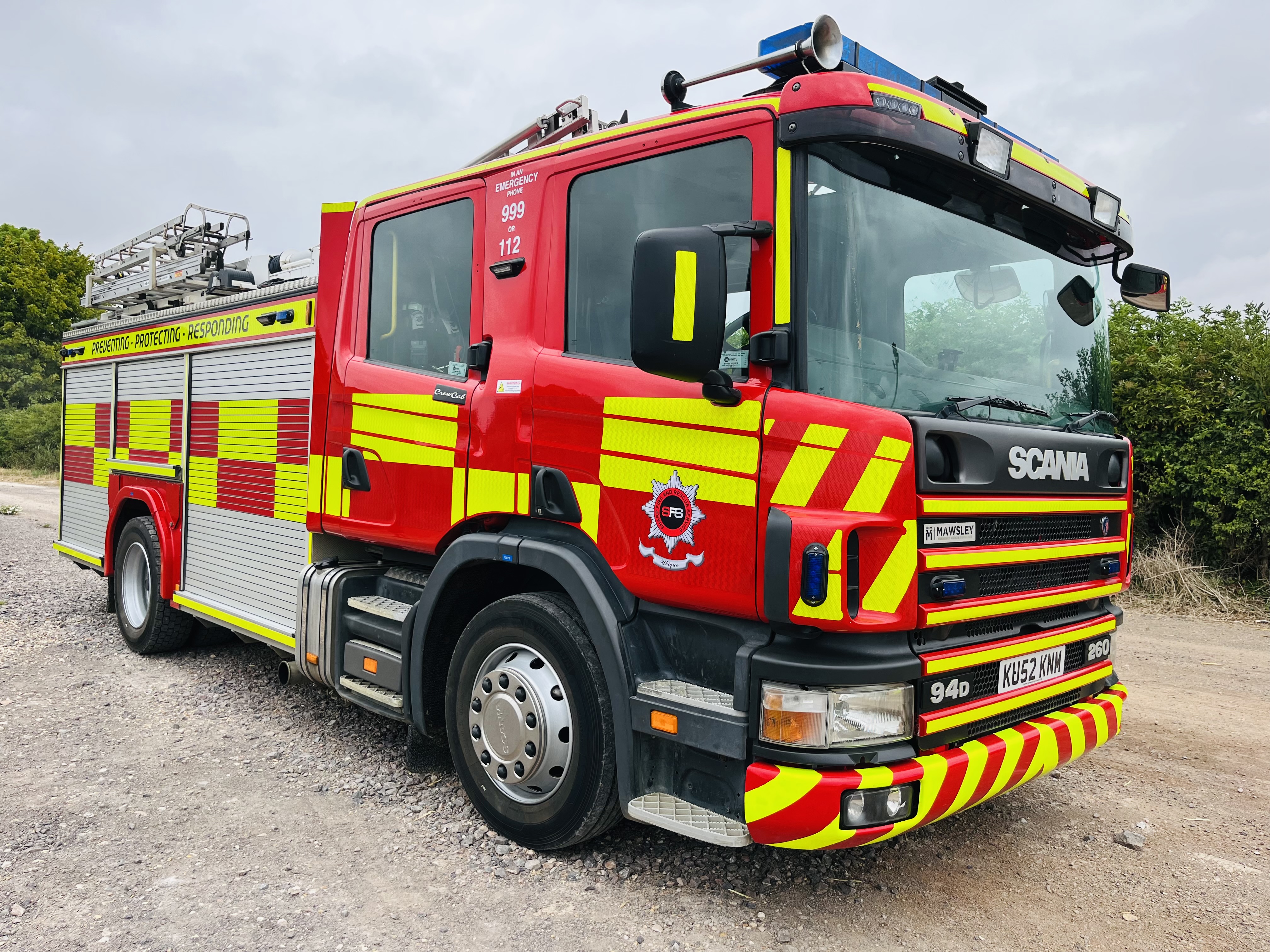 Scania 94D fire appliance in red and yellow livery